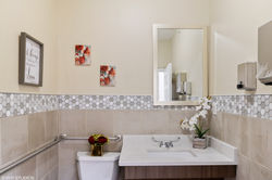 Private resident bathroom with a walk-in shower at a Generation Healthcare Managers senior living co