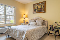 Comfortable private resident bedroom at a Generation Healthcare Managers senior living community.