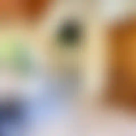 Rustic elegance in a cozy space with a charming fireplace mantel and a warm brick backdrop.