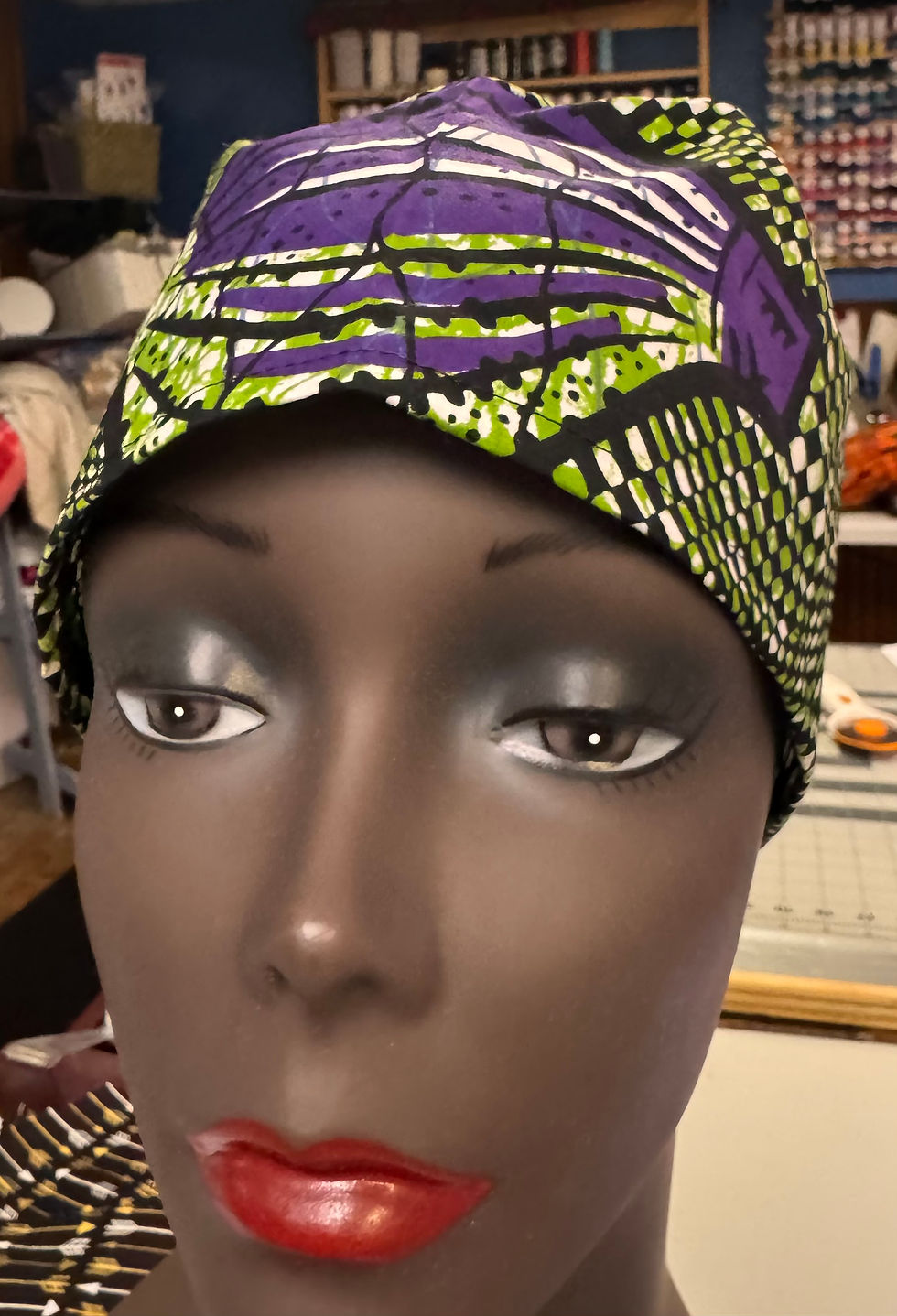 Thumbnail: purple and green scrub cap