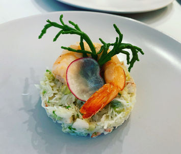 Crab and prawn seafood tower with samphire starter.