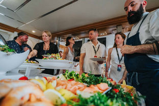 Bespoke corporate catering services, people queuing at luxury buffet