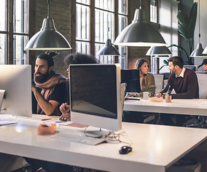 Office with monitors on desks