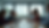 Eye-level view of a modern office meeting room with a BSL interpreter at the front