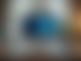 Eye-level view of a modern office desk with a video call setup