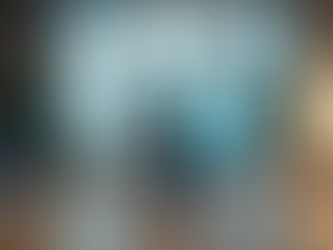 Eye-level view of a modern office desk with a video call setup