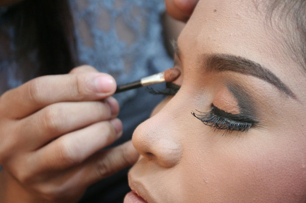carefully contouring eye shadow