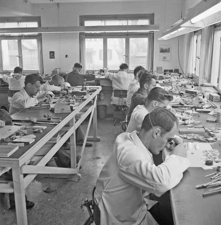 Watchmaker at work inside the company.