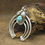 Thumbnail: *Sterling Silver And Turquoise Triple Naja Pendant By Cecil Perry