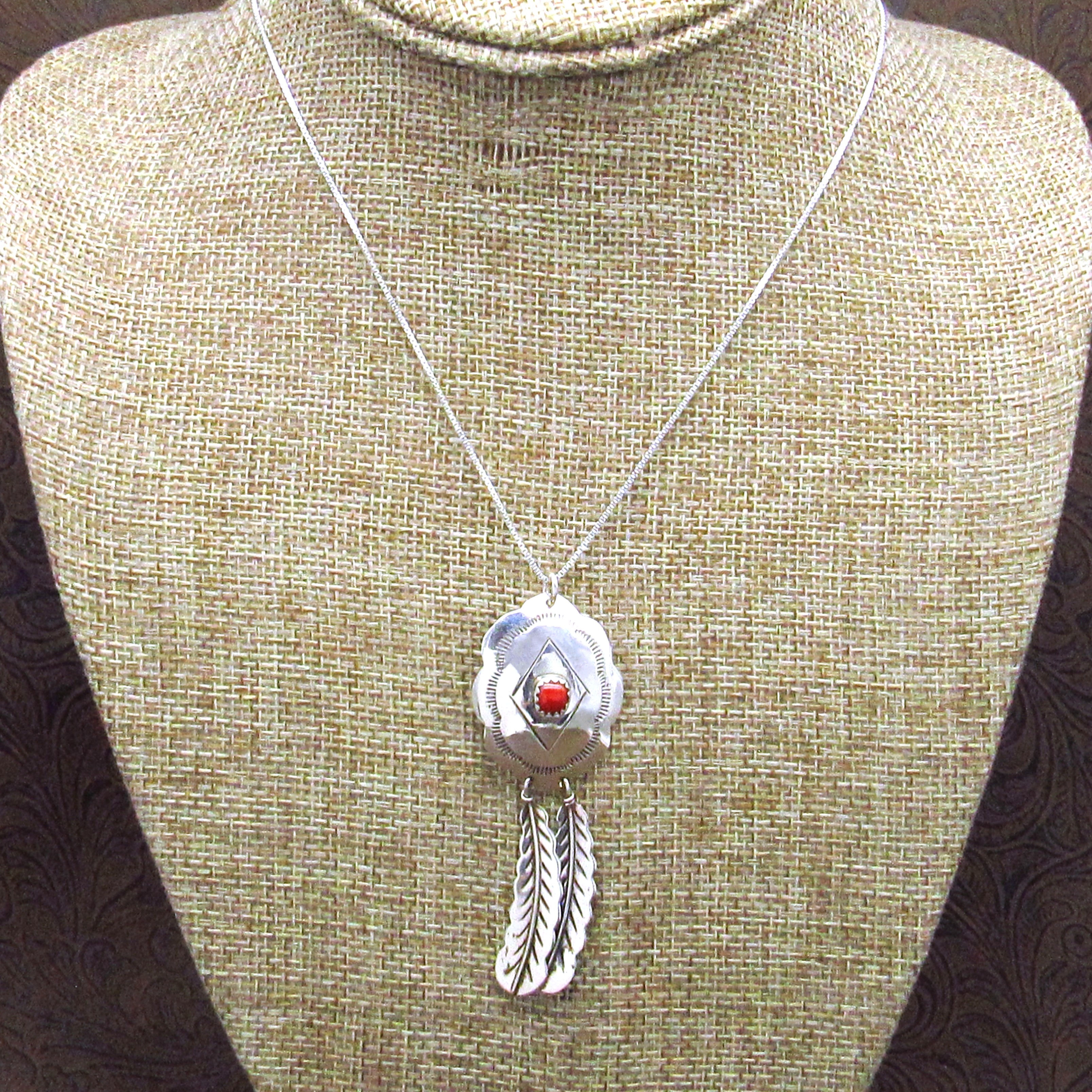 *Sterling Silver Pendant With A Round Coral Stone And Silver Feather Accents