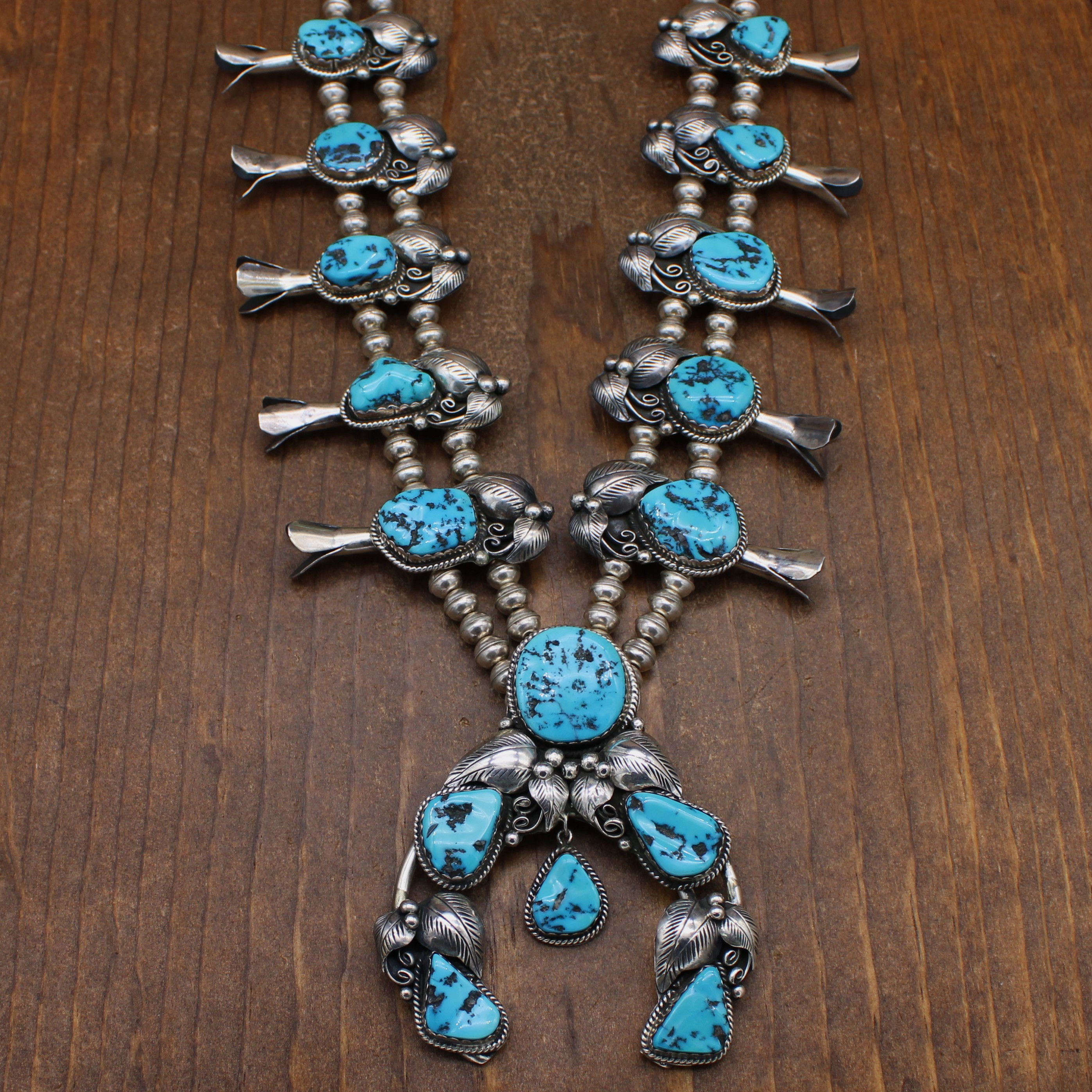 Sterling Silver and Turquoise Squash Blossom Necklace with Silver Leaves