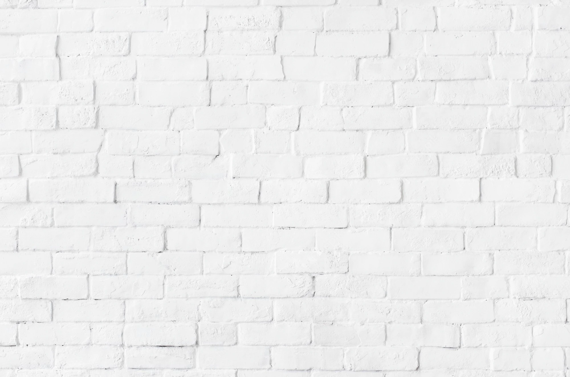white-brick-wall-textured-background_53876-138194.webp