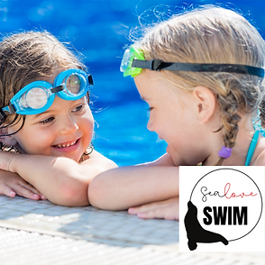 two young swimmers in a pool smiling at eachother