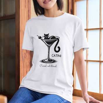 A chic and playful design featuring "Catini," with a cat lounging inside a martini glass, perfect for cat lovers who enjoy a touch of sophistication and humor.