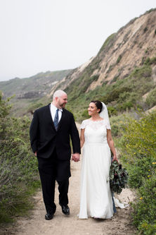 Bride and Groom on the Cliffs of a California Beach.