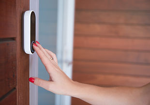 close-up-of-woman-ringing-front-doorbell-equipped-2024-10-19-18-28-33-utc.jpg
