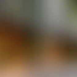 Exterior view of a modern luxury Australian hotel with green vertical gardens, outdoor seating, and welcoming entrance — ideal for showcasing Robo-Tek’s hospitality robots at NoVacancy Expo.