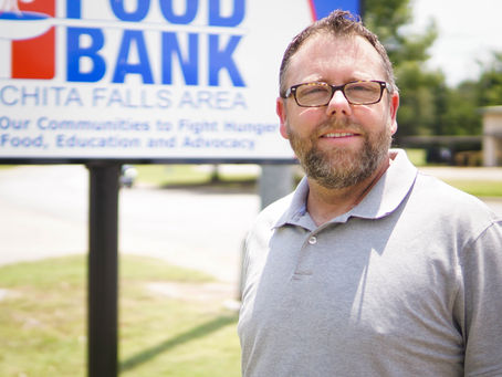 Rusty Celebrates History with the Food Bank