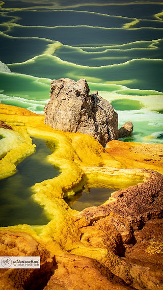 The yellow sulphur fields of Dallol Ethiopia in the Danakil depression shine in strong colours