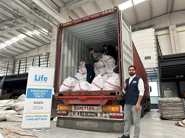 Photo of the packing of 2,000 winterized tents which were then delivered to Gaza.  