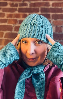 Holiday pack diy knitting kit with Calin Beanie, Willow scarf and easy mittens in Peacock worn by Julie