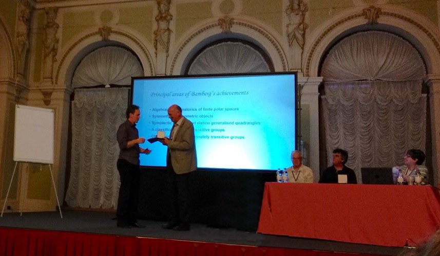 John receives ICA medal.