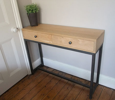 Crooked console table in european oak and steel.