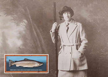 Miss Georgina Ballantine posing with cane rod & biggest ever British salmon fish from Glendelvine beat on the River Tay.