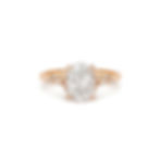 Rose gold ring with a large diamond and smaller diamonds on the band.