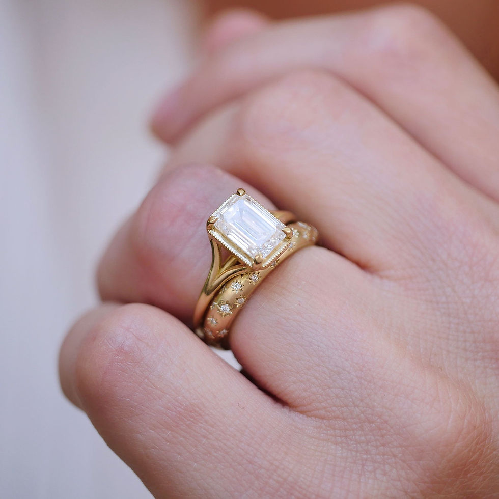Thumbnail: 14k yellow gold emerald cut solitaire ring with a diamond star engraved wedding band
