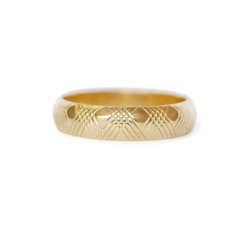 A 5mm wide gold band with criss-cross details.
