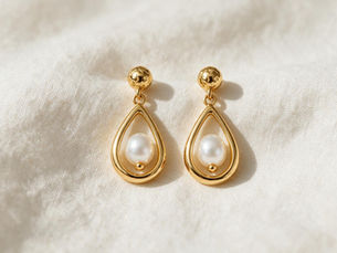 A pair of fine gold drop earrings