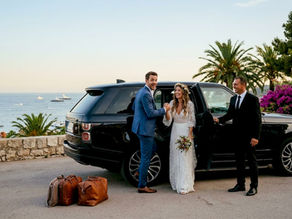 Newlywed couple entering luxury private transfer vehicle