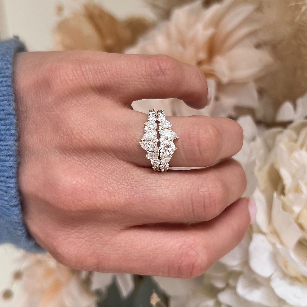 Thumbnail: Crafted with precision, the band’s alternating pear and marquise diamonds create a harmonious and striking visual pattern that is both modern and luxurious.
