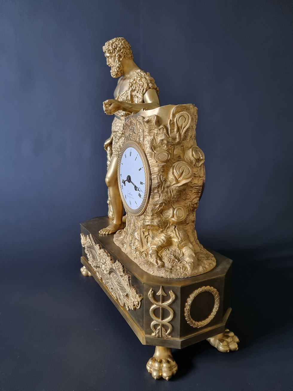 Miniature : Pendule Hercule d'époque Empire en bronze doré.