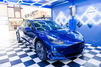 Blue Tesla Model 3 with Borophene ceramic coating for ultimate paint protection in Michigan.