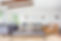 Bright living room with varied seating and wood-beamed ceiling