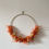 Miniature : Couronne murale rouge orangé