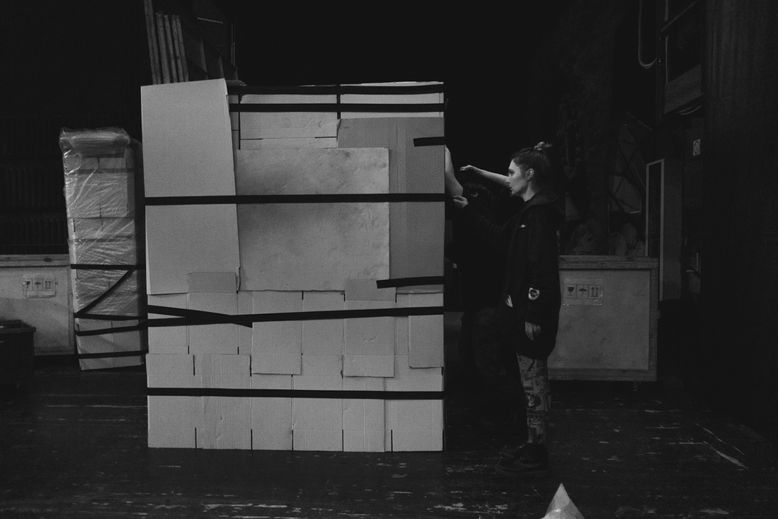 woman checking packed box  black and white photography 