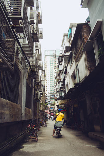 guy in yellow on motorcycle in the alley 
