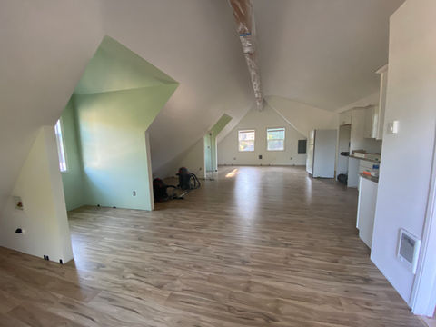 The high ceilings, exposed beam, and beautiful dormer windows gave me an exceptional staring point. From there, I added fresh, bright paint that embraces the Portland light year-round. Additionally, we added LVP flooring in a beautifully warm tone.