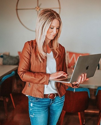 woman holding laptop