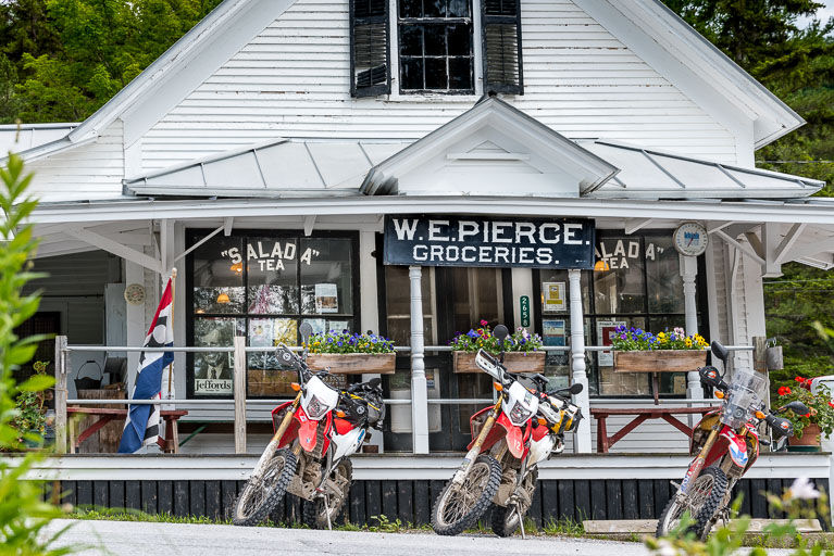 Motorcycles parked in front of W. E. Pierce Store
