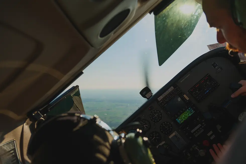 Close-up of aircraft cockpit ignition and engine start switches, representing the Commercial Pilot training program
