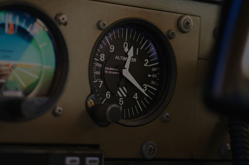 Close-up of an aircraft altimeter and instrument panel gauges, representing the Instrument Rating training program