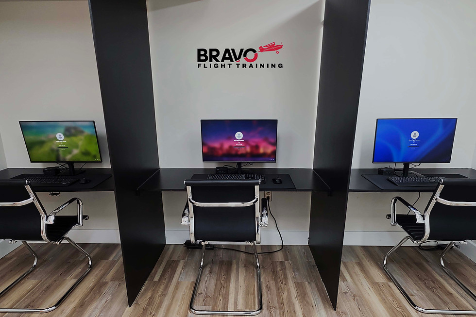 Bravo Flight Training testing center with three computer workstations for FAA knowledge tests