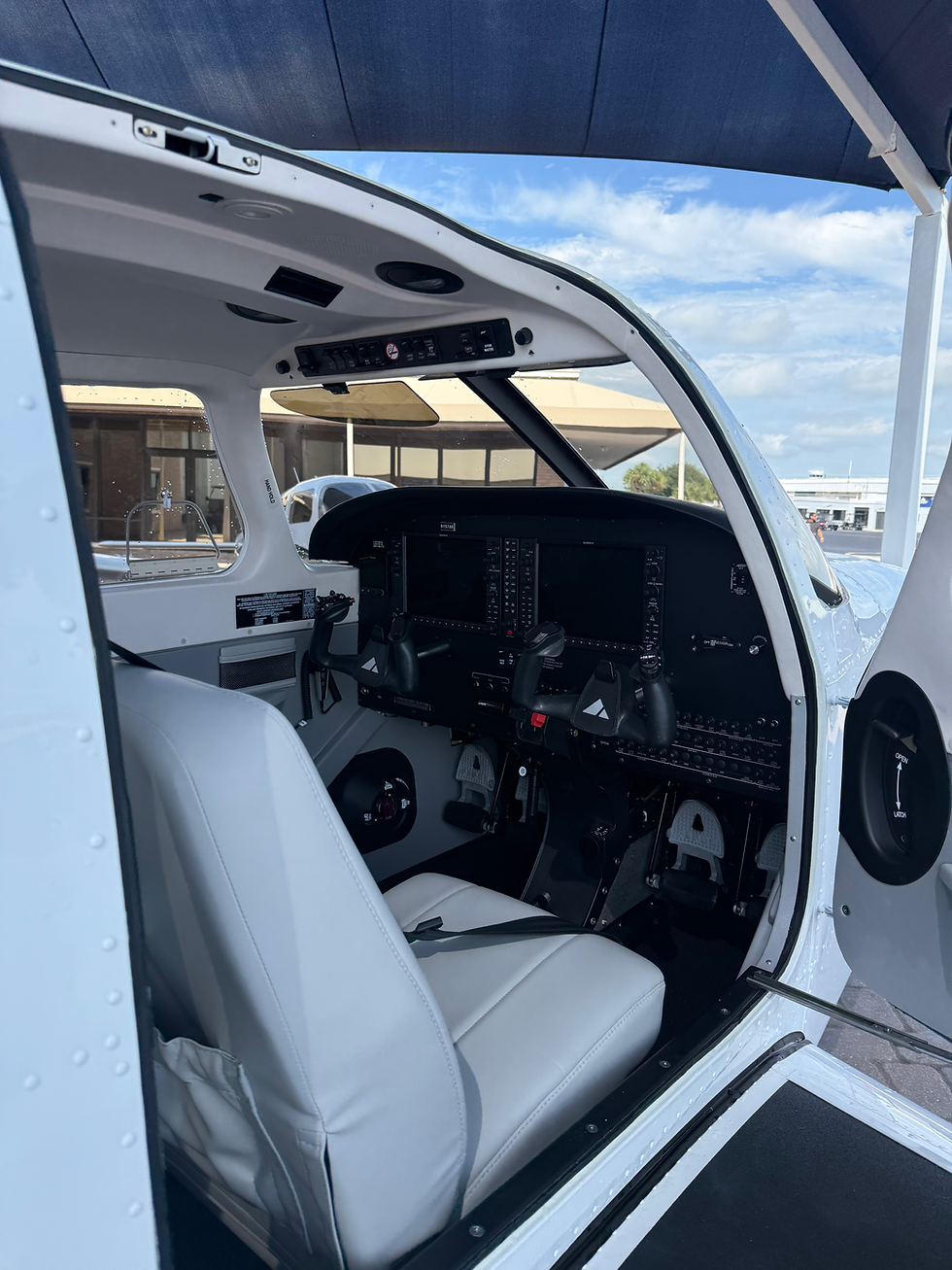 Interior view of the Piper Archer TX 2026 cockpit showing the Garmin G1000 NXi glass avionics suite