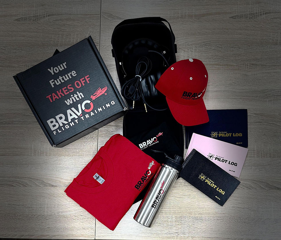 Flat lay of Bravo Flight Training branded merchandise including a cap, headset case, and "Your Future Takes Off with Bravo Flight Training" welcome book, representing the Premium Package