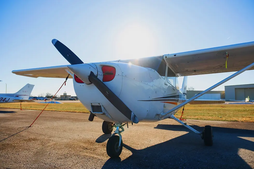 White single-engine aircraft parked on the ramp at sunrise, representing hourly aircraft rental