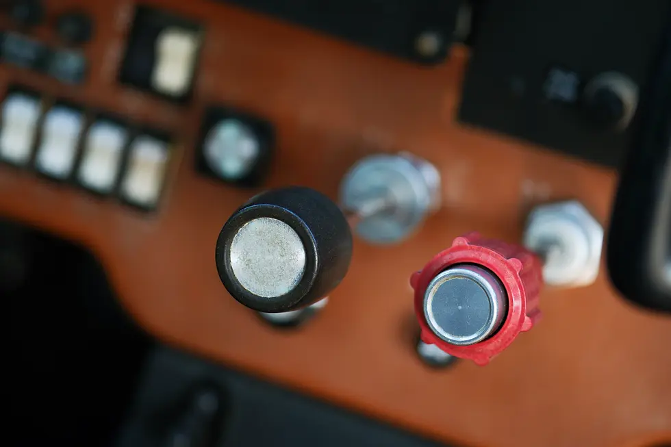 Close-up of an aircraft cockpit switch panel with ignition and avionics switches, representing the Private Pilot License training program